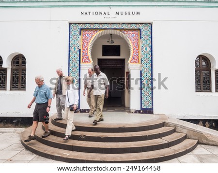 DAR ES SALAAM, TANZANIA - JANUARY 18, 2015: People go out from the National Museum in Dar es Salaam, Tanzania, on a Sunday afternoon.