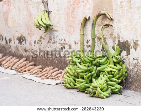 Local bananas and cassavas sold on one of the street of Stone Town, Zanzibar, East Africa.