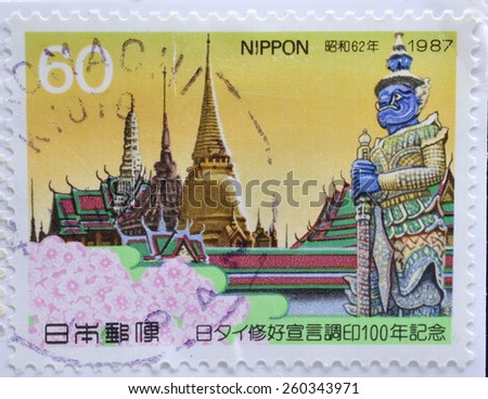 JAPAN - CIRCA 1987 : postage stamp printed in Japan shows The Temple of the Emerald Buddha with sakura flowers(The memorial of centenary of the Japan-Thailand Friendship Declaration), circa 1987