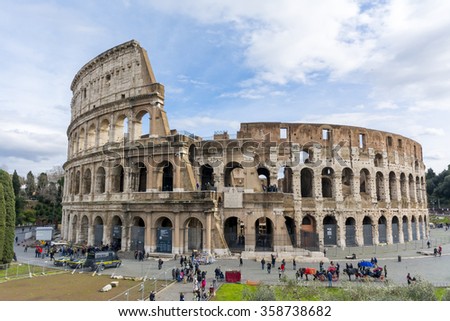 ROME, ITALY - FEBRUARY 04, 2015 : People visiting the Colosseum in Rome, Italy. The Colosseum is a most popular tourist attraction in Rome.