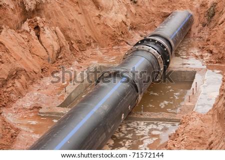 New plastic water conduit with the base in a foundation ditch