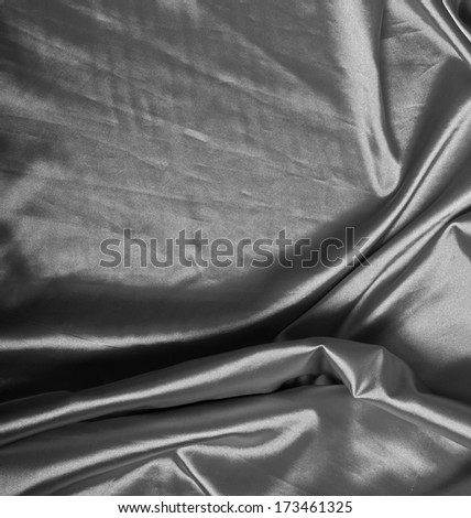 background of silver silk with a place for text