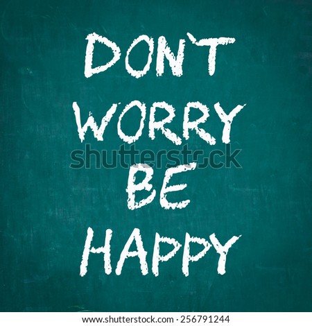 DON\'T WORRY BE HAPPY written on chalkboard