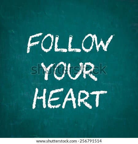 FOLLOW YOUR HEART written on chalkboard