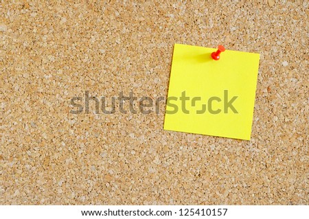Cork board with yellow post-it