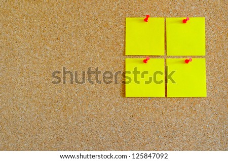 Cork board with multiple yellow post-it