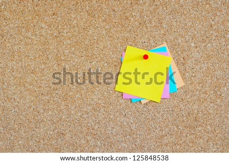 Cork board with multiple colorful post-it