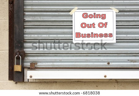 Sign on a closed steel door of a business that has gone bankrupt