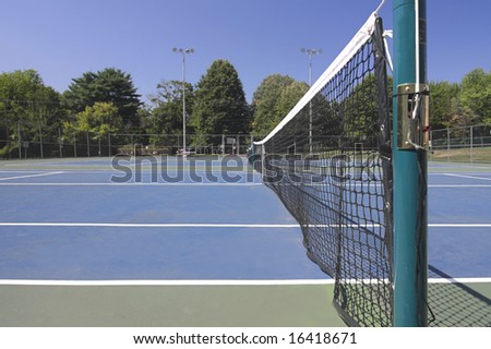 Close-up of a tennis court net post using a wide-angle lens
