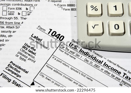 Close-up of a Federal Tax Return Form and a calculator