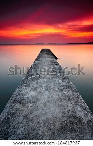 Long Path Of Jetty During Sunset