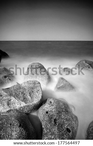 A Long Exposure At Beach With Repeating Rocks Black And White