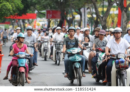 Hanoi - June 14: Unidentified Riders Ride Motorbikes On Busy Road On June 14, 2010 In Hanoi, Vietnam. Motorbike Is The Most Favorite Vehicle For Hanoians, So Hanoi Is Always Called The Motorbike City.