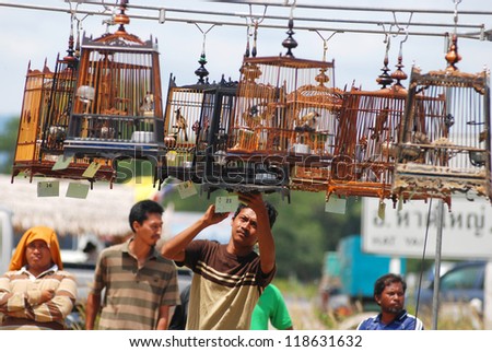 HATYAI,THAILAND - AUGUST 12: Row of bird cages with competitions during famous local birds sound contest on August 12, 2012 in Hatyai, Thailand