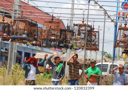 HATYAI,THAILAND - AUGUST 12: Row of bird cages with competitions during famous local birds sound contest on August 12, 2012 in Hatyai, Thailand