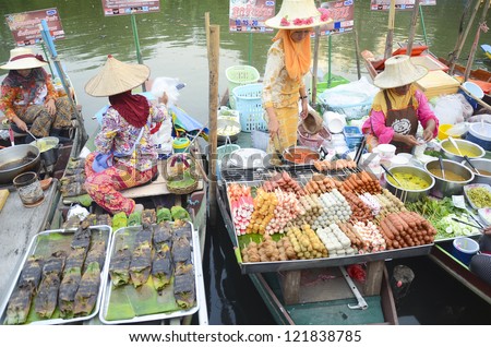 HATYAI, THAILAND - FEB 12: Women make Thai food at Khlong Hae Floating Market on February 12, 2012 in Hatyai, Thailand. Its popular for traditional style Thai food and old Thai culture.