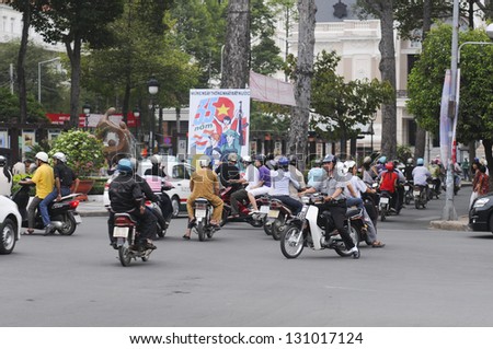 HANOI - JUNE 14: Unidentified riders ride motorbikes on busy road on June 14, 2010 in Hanoi, Vietnam. Motorbike is the most favorite vehicle for Hanoians, so Hanoi is always called the motorbike city.