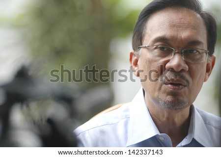 KUALA LUMPUR - JAN 20 : Malaysian opposition leader Anwar Ibrahim speaks during an interview with Press at his office in Kuala Lumpur on January 20, 2013