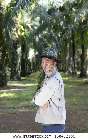 man worker in the palm oil gardent