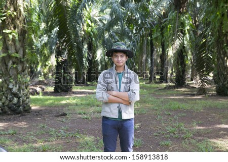 Portrait of a man worker in the palm oil gardent