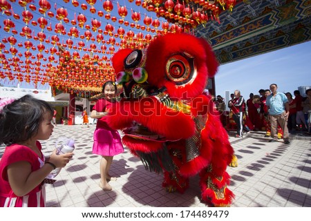 KUALA LUMPUR-JAN 31: Malaysian Traditional Lion Dance performs a dance routine outside the Thean Hou Temple during Chinese New Year celebrations on January 31, 2014 in Kuala Lumpur, Malaysia.