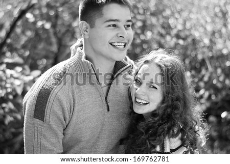 Young beautiful couple in park