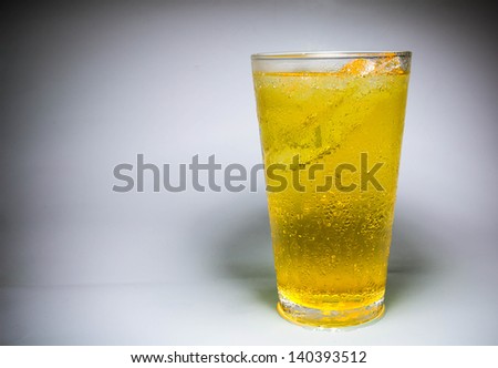 Ice beer in glass on background
