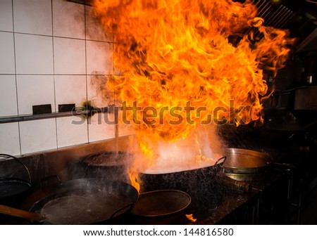 Fire gas burn is cooking on iron pan,stir fire very hot