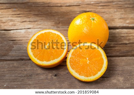 Oranges cut set on old wooden