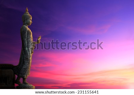 Big Buddha statue on sunrise sky