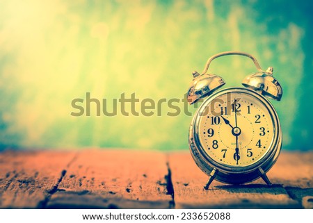 Vintage background with retro alarm clock on table.10.30 am good time of coffee for healthy