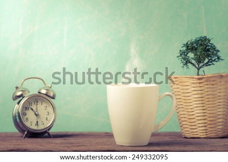 Cup with grunge background. 10.30 am good time of coffee for health