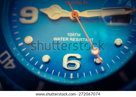 Close-up analog  hand clock  to six