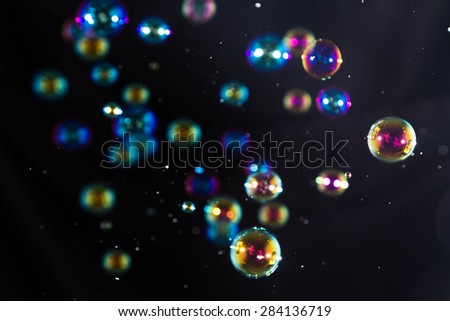 Blur Abstract colorful soap bubbles wallpaper isolated on black background