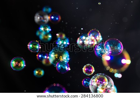 Blur Abstract colorful soap bubbles wallpaper isolated on black background