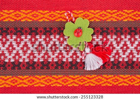 Bulgarian Martenitsa. Martenitsa is a piece of adornment, made of white and red threads. It symbolizes spring and the wish for good health. Worn from 1st March. Other name is Baba Marta.