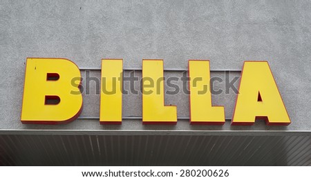 Varna, Bulgaria - May 21, 2015: Bila logo on wall in the city of Varna. BILLA is an European supermarket chain originating in Austria with more than 1000 stores. It is owned by Germany\'s REWE Group.