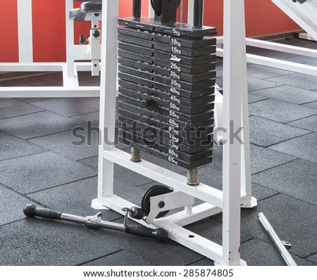Fitness center trainer weights equipment. fitness theme