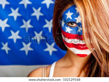 Patriotic American woman with the USA flag painted on her face