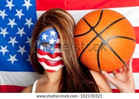 Female American basketball fan with the USA flag painted on her face