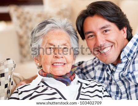 Happy portrait of a grandmother and her grandson smiling