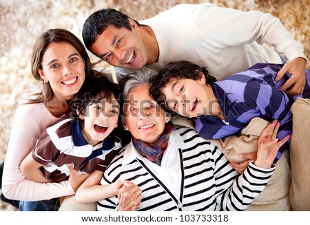 Grandmother and her family looking happy at home