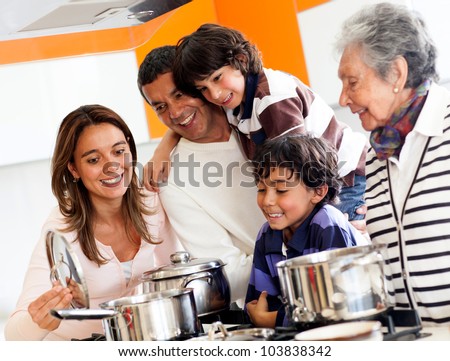Happy family cooking together at home and smiling