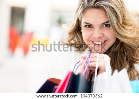 Female shopper holding bags at the shopping center