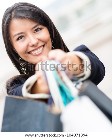 Beautiful female shopper looking very happy