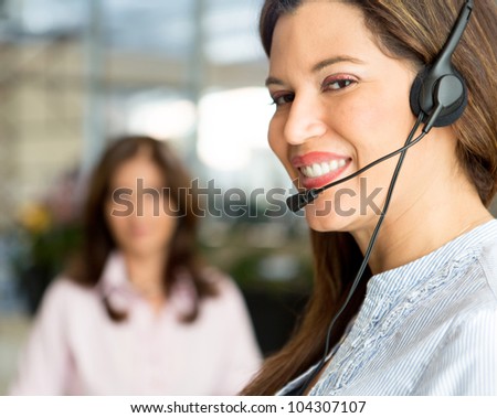 Portrait of a female operator wearing headset