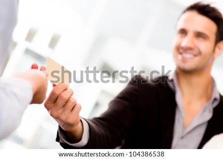 Business man paying with a credit or debit card