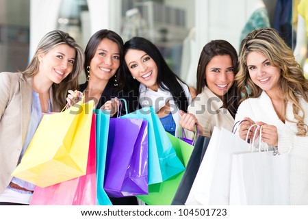 Group of shopping women looking very happy