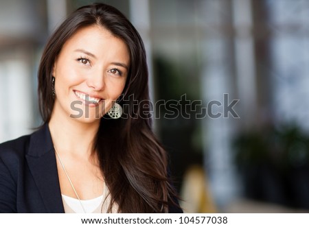 Friendly business woman smiling at the office
