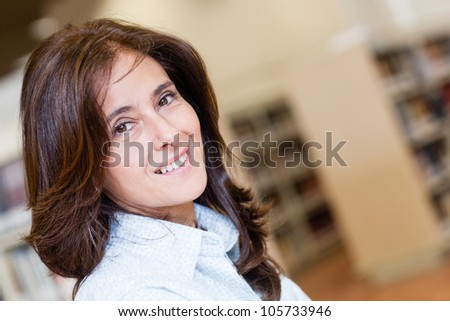 Portrait of a woman at the library smiling